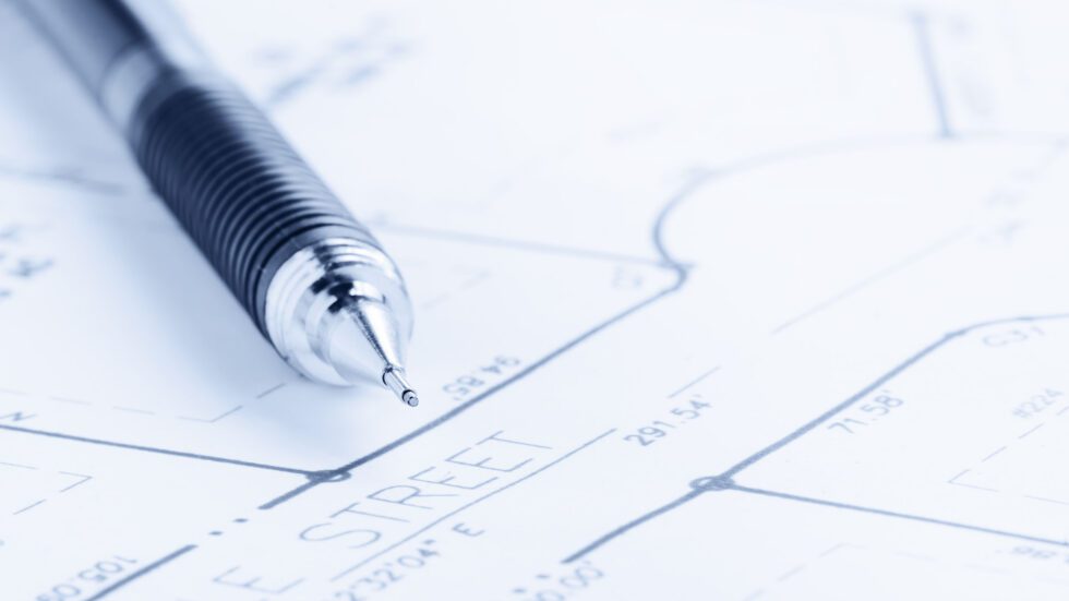 site-planning-drawing close up of mechanical pencil and plan